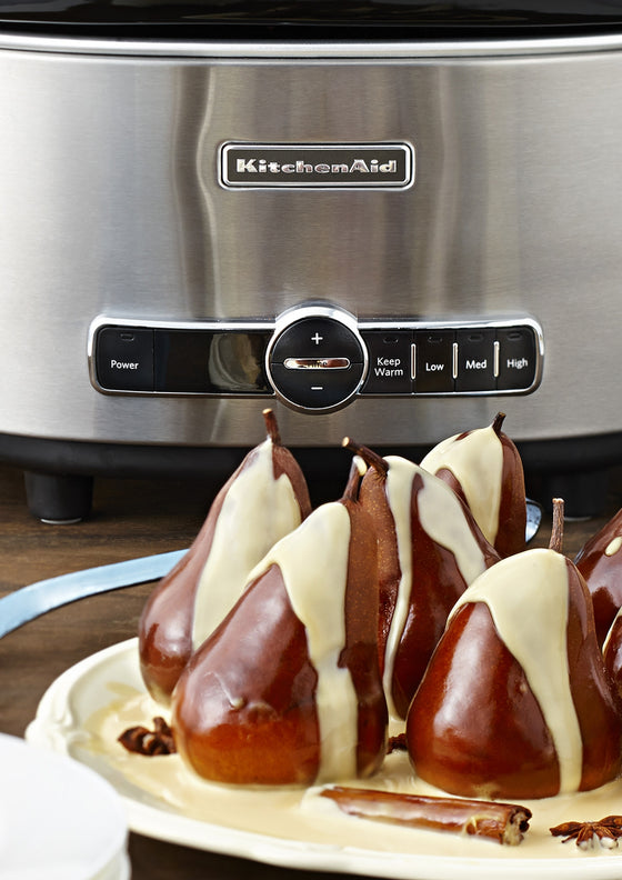 Whole poached pears in a spiced caramelised cream sauce