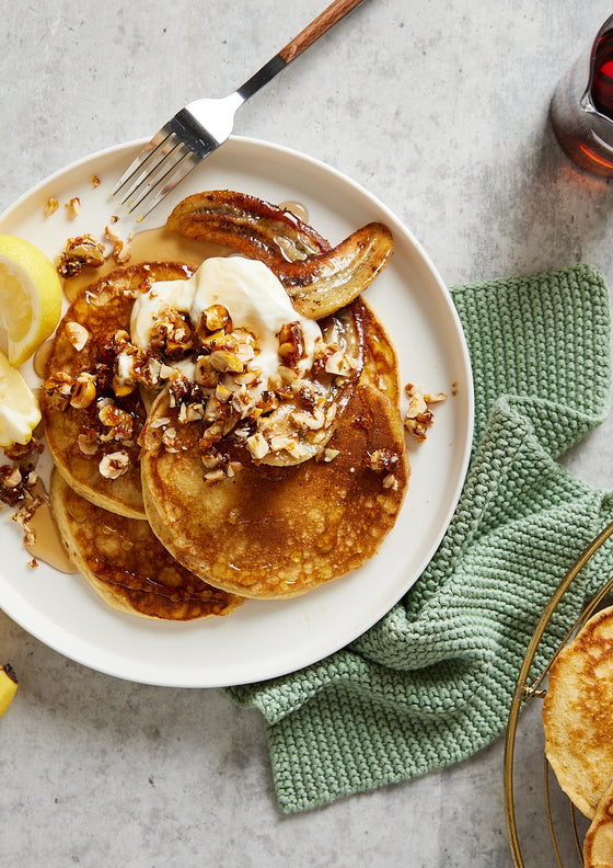 Ricotta pancakes with hazelnuts and caramelised banana