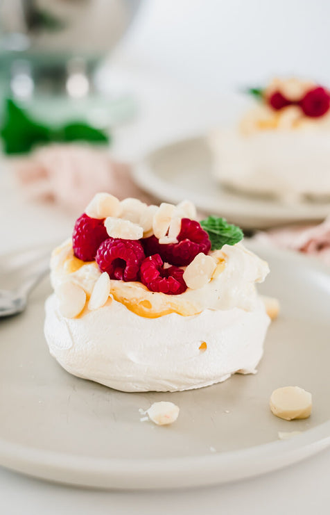 Vanilla bean and mango pavlova with macadamia | Melanie Lionello