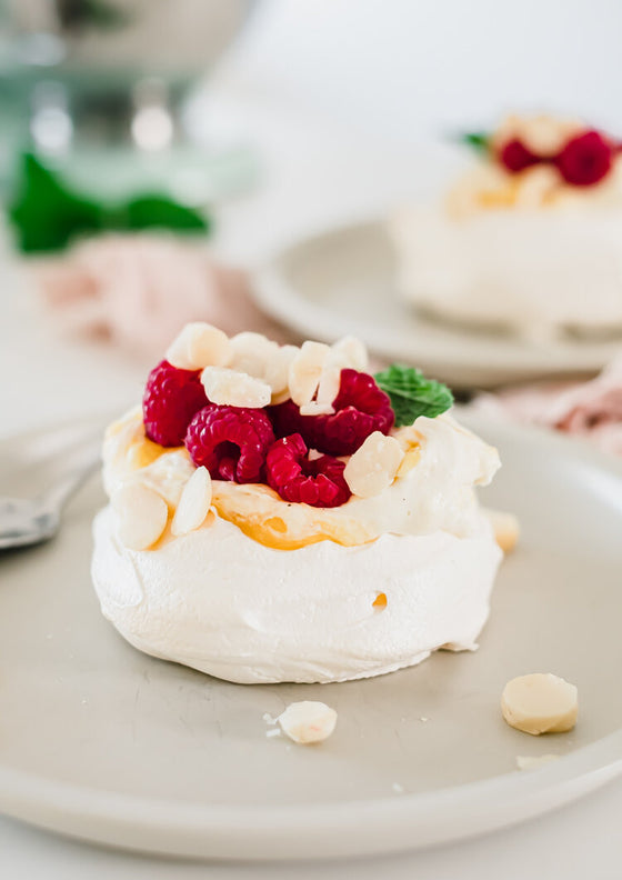 Vanilla bean and mango pavlova with macadamia | Melanie Lionello